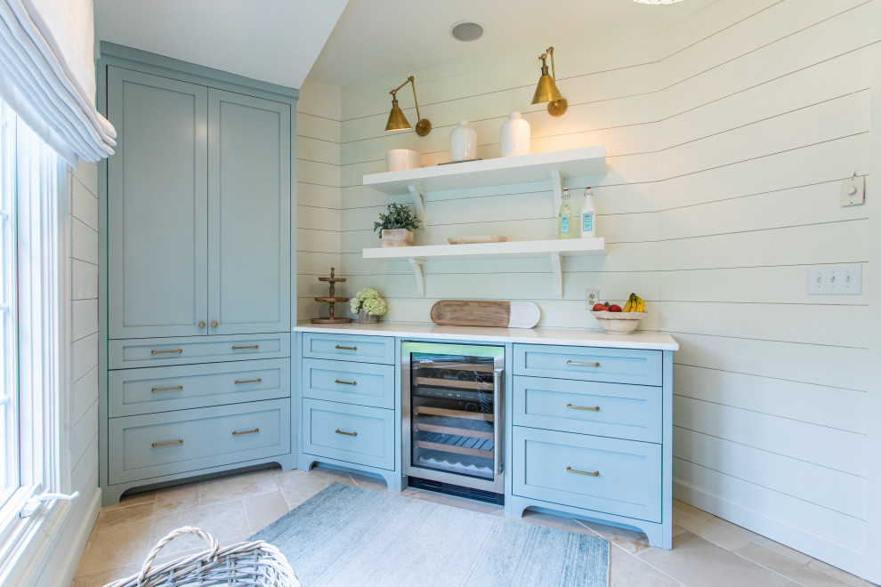 Photo of a transitional laundry room in Atlanta with an undermount sink, shaker cabinets, turquoise cabinets, white splashback, shiplap splashback, white walls, an integrated washer and dryer, white benchtop and planked wall panelling.