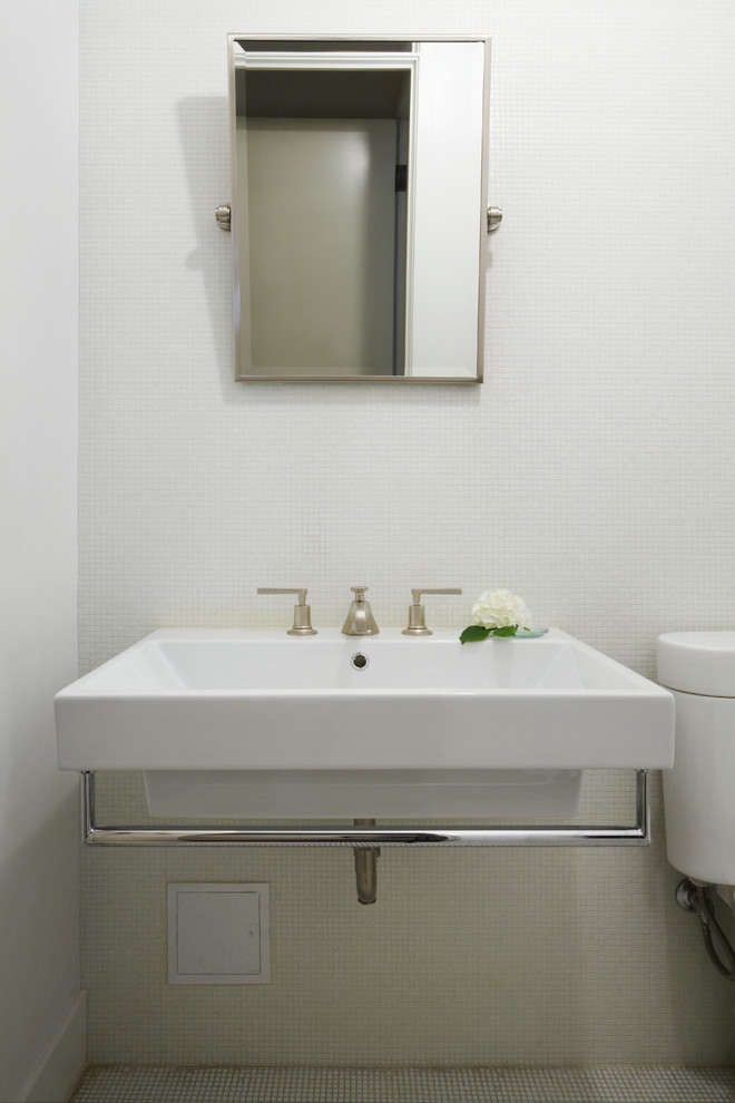 This is an example of a small transitional 3/4 bathroom in New York with a wall-mount sink, white tile, mosaic tile, mosaic tile floors, a two-piece toilet, white walls and white floor.