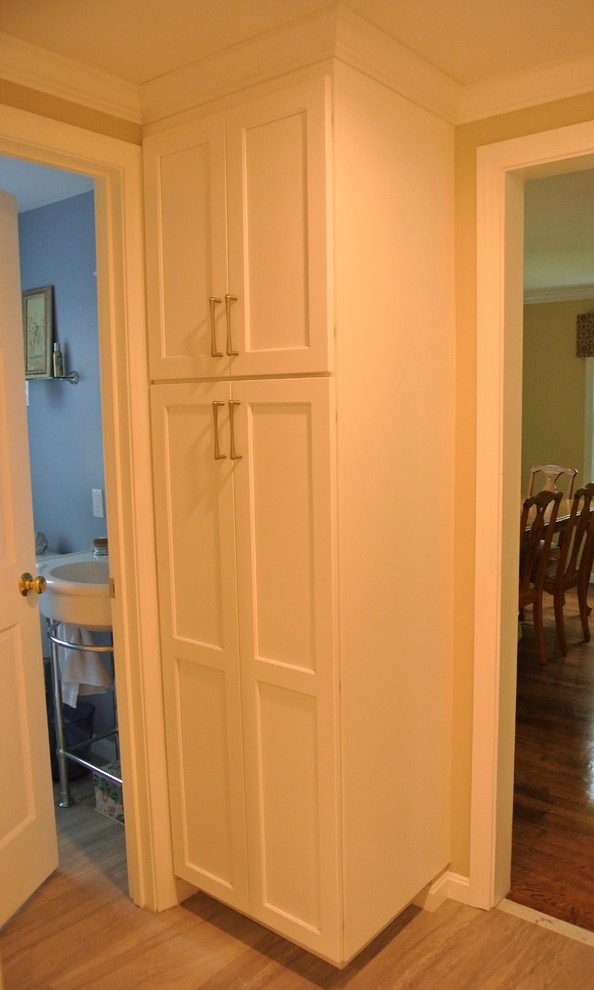 Inspiration for a transitional kitchen remodel in Boston with an undermount sink, shaker cabinets, granite countertops, subway tile backsplash, stainless steel appliances and an island