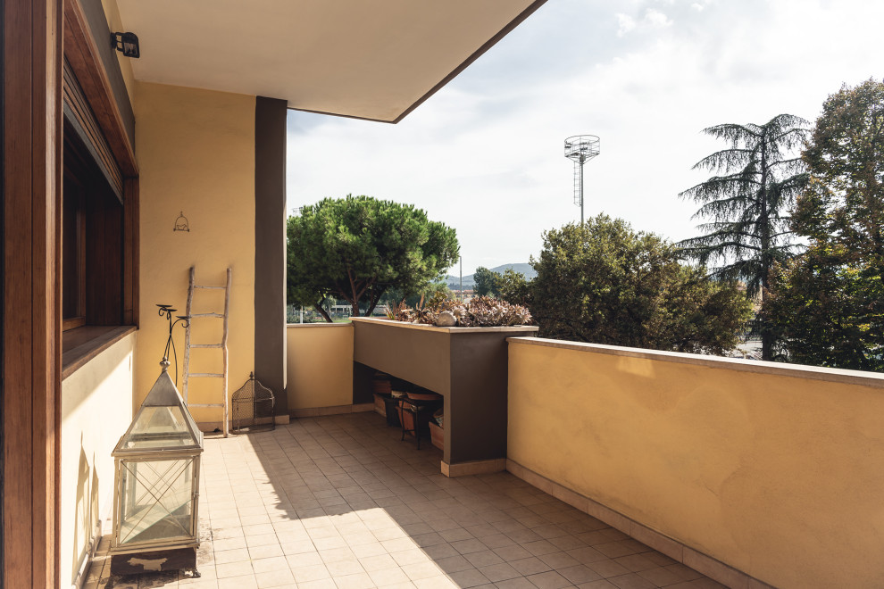 This is an example of a small modern balcony for for apartments in Florence with mixed railing.