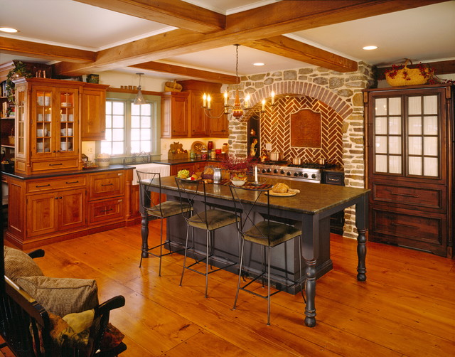 Beaded inset cabinetry in cherry with stone archway - Rustic - Kitchen ...