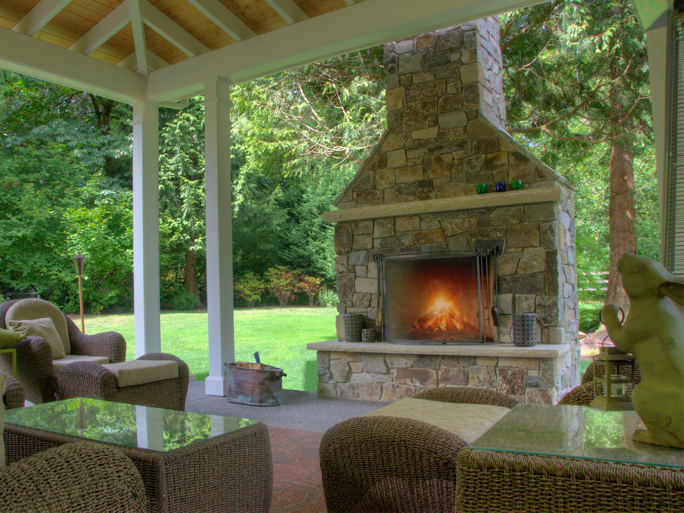 Large arts and crafts backyard patio in Other with a fire feature, concrete slab and a pergola.