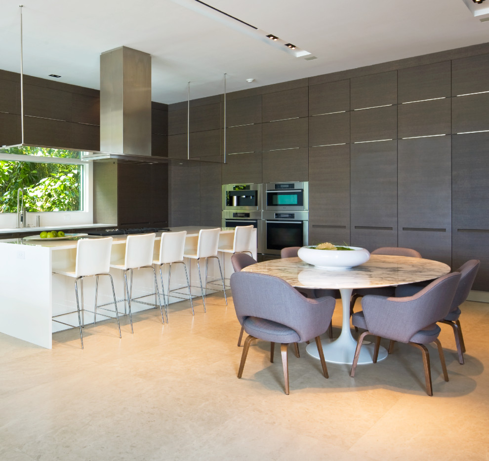 Contemporary l-shaped eat-in kitchen in Miami with white splashback, with island and white benchtop.