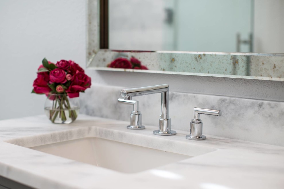 Bathroom - small transitional bathroom idea in Austin with raised-panel cabinets, gray cabinets and marble countertops