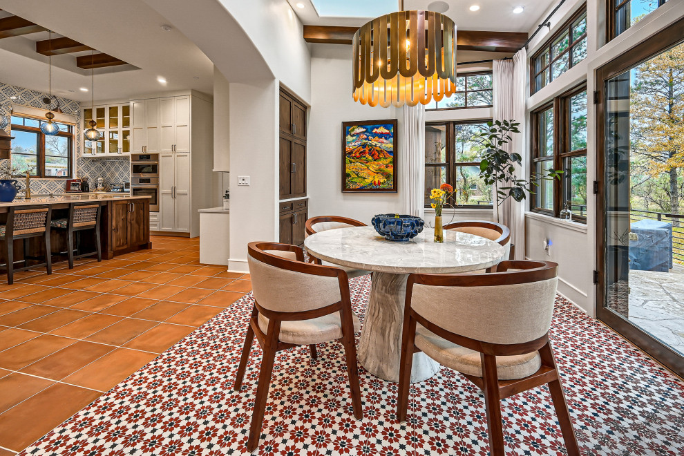 Example of a mountain style dining room design in Denver