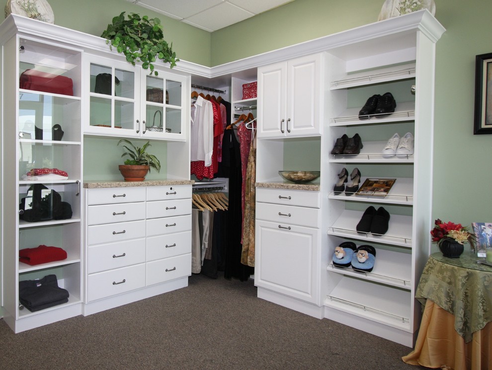 Photo of a large transitional women's walk-in wardrobe in Phoenix with white cabinets, carpet and flat-panel cabinets.