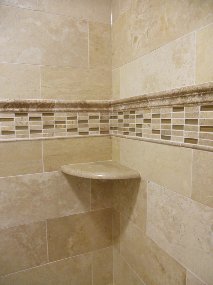 Photo of a small traditional bathroom in Philadelphia with an alcove tub, an alcove shower, beige tile, beige floor and a sliding shower screen.