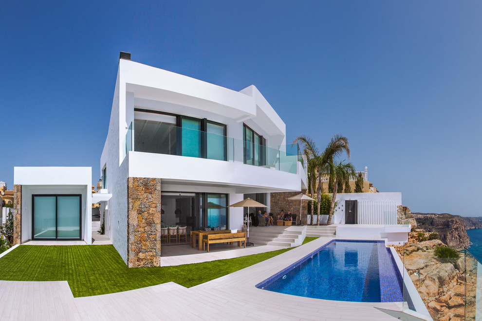 Large contemporary backyard rectangular lap pool in Alicante-Costa Blanca.