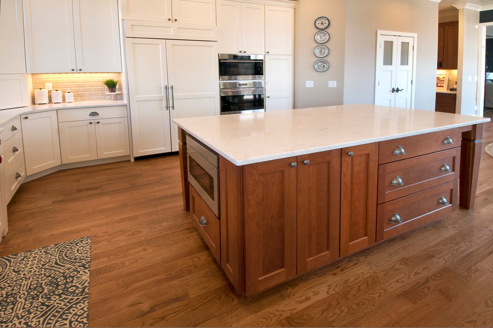 Inspiration for a transitional kitchen in Other with recessed-panel cabinets.