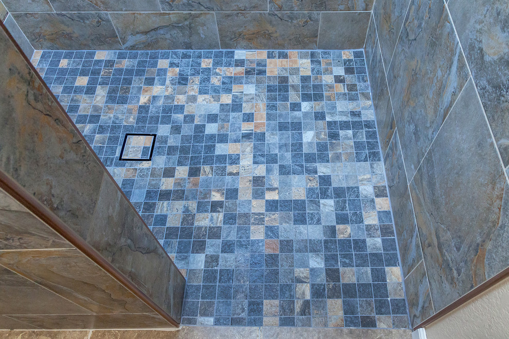 Home design - mid-sized transitional master gray tile and porcelain tile porcelain tile and brown floor home design idea in Phoenix with shaker cabinets, dark wood cabinets, a one-piece toilet, beige walls, an undermount sink, granite countertops and beige countertops