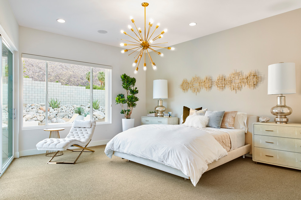 Photo of a midcentury master bedroom in Orange County with beige walls, carpet, no fireplace and beige floor.