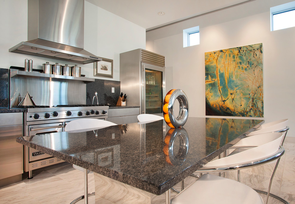 This is an example of a contemporary kitchen in Omaha with granite benchtops and stainless steel appliances.