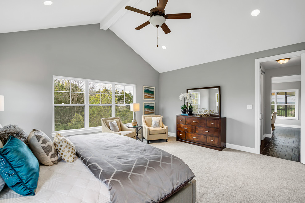 Photo of a mid-sized transitional master bedroom in St Louis with grey walls, carpet, no fireplace and brown floor.