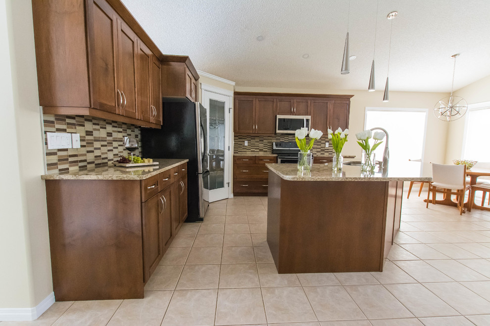Inspiration for a mid-sized transitional l-shaped ceramic tile and beige floor eat-in kitchen remodel in Edmonton with a double-bowl sink, shaker cabinets, brown cabinets, quartz countertops, beige backsplash, glass tile backsplash, stainless steel appliances and an island