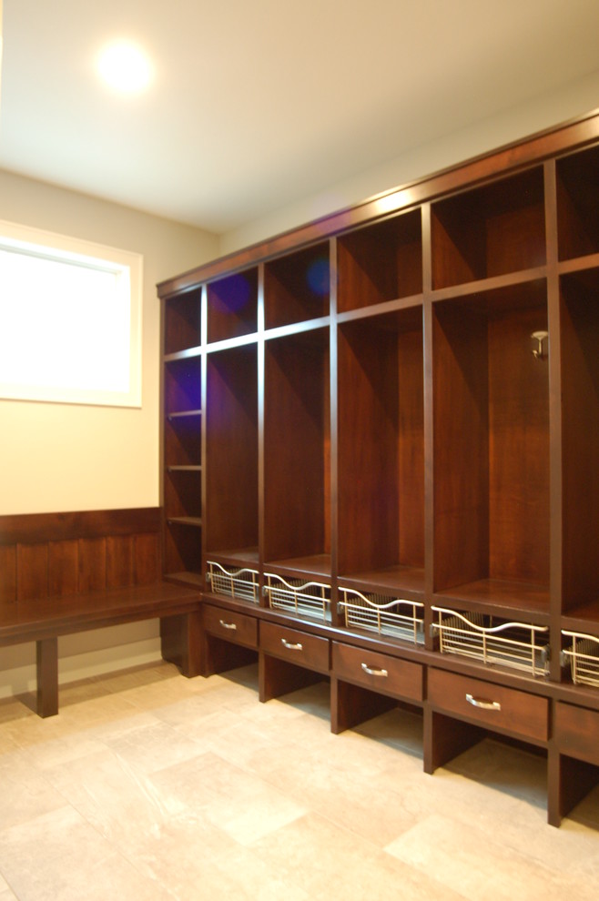 Mid-sized transitional dark wood floor mudroom photo with gray walls and a dark wood front door