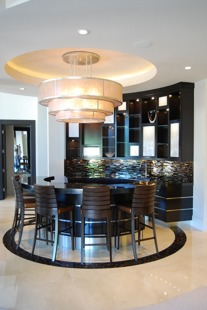 Design ideas for a mid-sized contemporary single-wall seated home bar in Salt Lake City with an undermount sink, flat-panel cabinets, black cabinets, solid surface benchtops, multi-coloured splashback, metal splashback, porcelain floors and white floor.