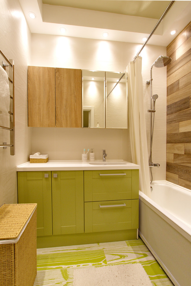 This is an example of a mid-sized transitional master bathroom in Saint Petersburg with green cabinets, solid surface benchtops, an alcove tub, a shower/bathtub combo, a shower curtain, recessed-panel cabinets, white walls and multi-coloured floor.