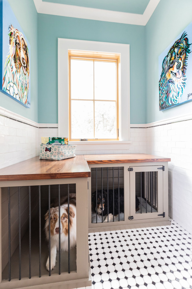 Inspiration for a large country l-shaped dedicated laundry room in Houston with an undermount sink, shaker cabinets, black cabinets, granite benchtops, blue walls, ceramic floors, a side-by-side washer and dryer, multi-coloured floor and black benchtop.