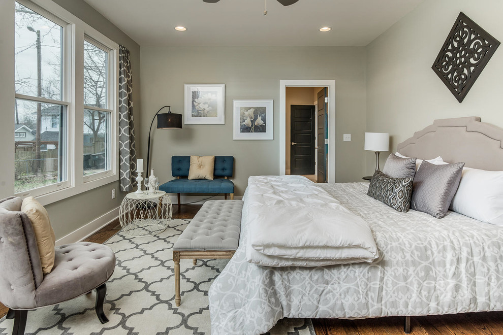 Inspiration for a large transitional master bedroom in Nashville with beige walls, light hardwood floors and no fireplace.