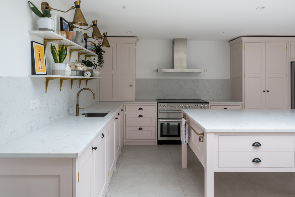 Inspiration for a medium sized contemporary grey and pink l-shaped kitchen/diner in Buckinghamshire with shaker cabinets, pink cabinets, white splashback, an island and white worktops.