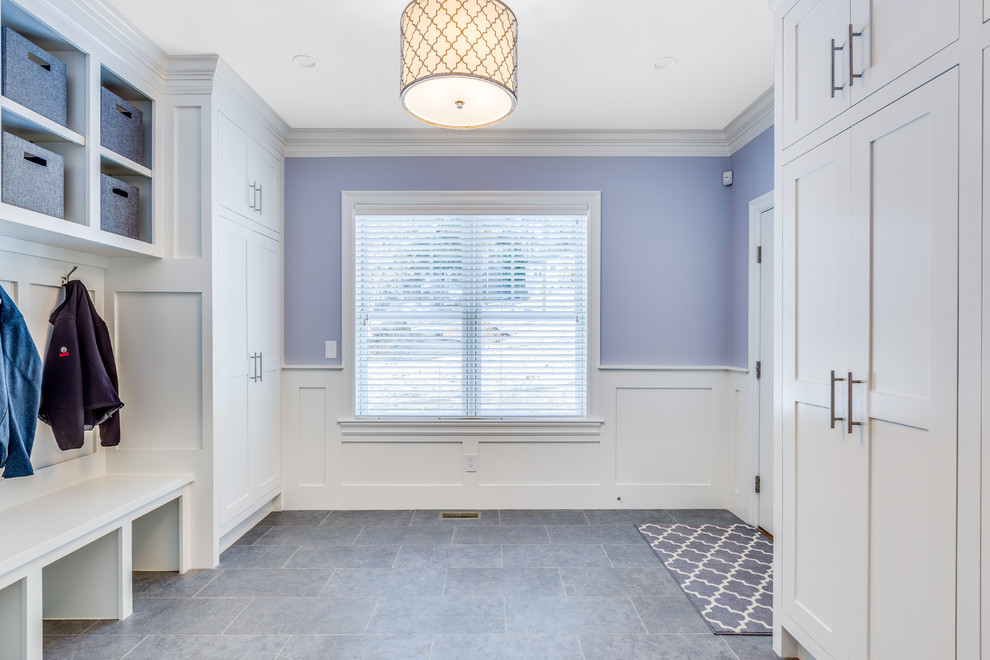Design ideas for a mid-sized transitional mudroom in Boston with purple walls and ceramic floors.