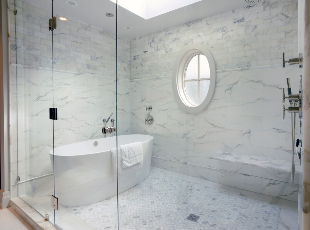 Transitional bathroom in Atlanta with a freestanding tub and marble floors.