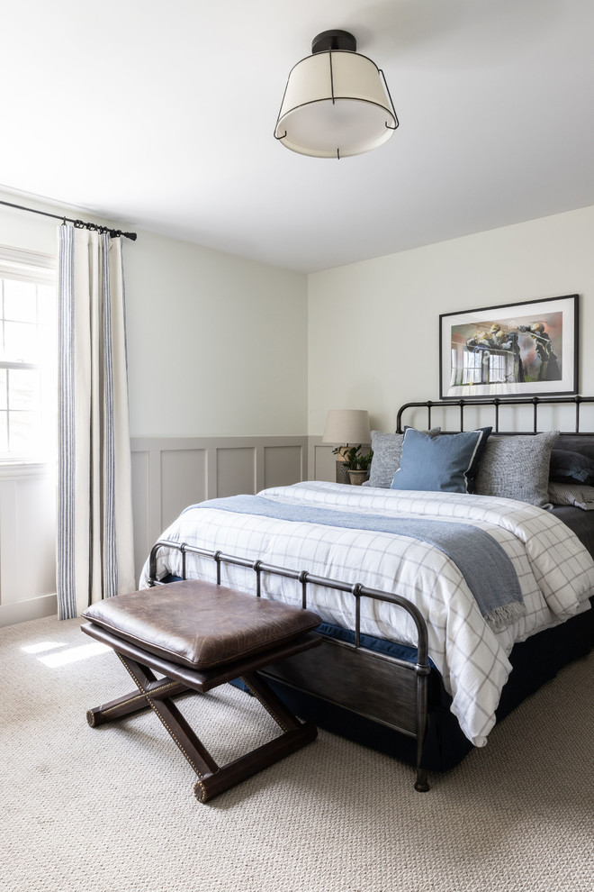 Derby House Kids Wing - Newly remodeled boys bedroom with new batten board wainscoting, closet doors, trim, paint, lighting, and new loop wall to wall carpet. Queen bed with windowpane plaid duvet. Photo by Emily Kennedy Photography.