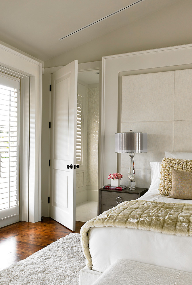 Inspiration for a transitional bedroom in Miami with beige walls and dark hardwood floors.