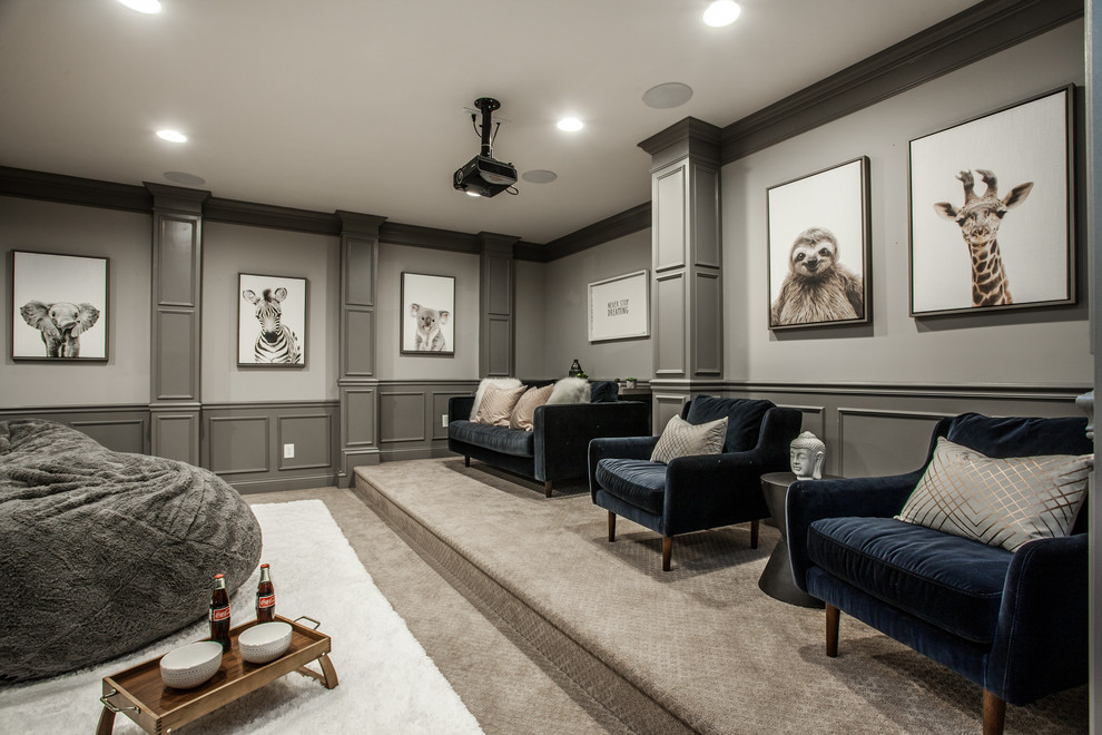 This is an example of a traditional enclosed home theatre in Indianapolis with grey walls, carpet and grey floor.