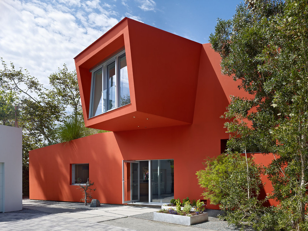 Photo of a modern two-storey red house exterior in Los Angeles.