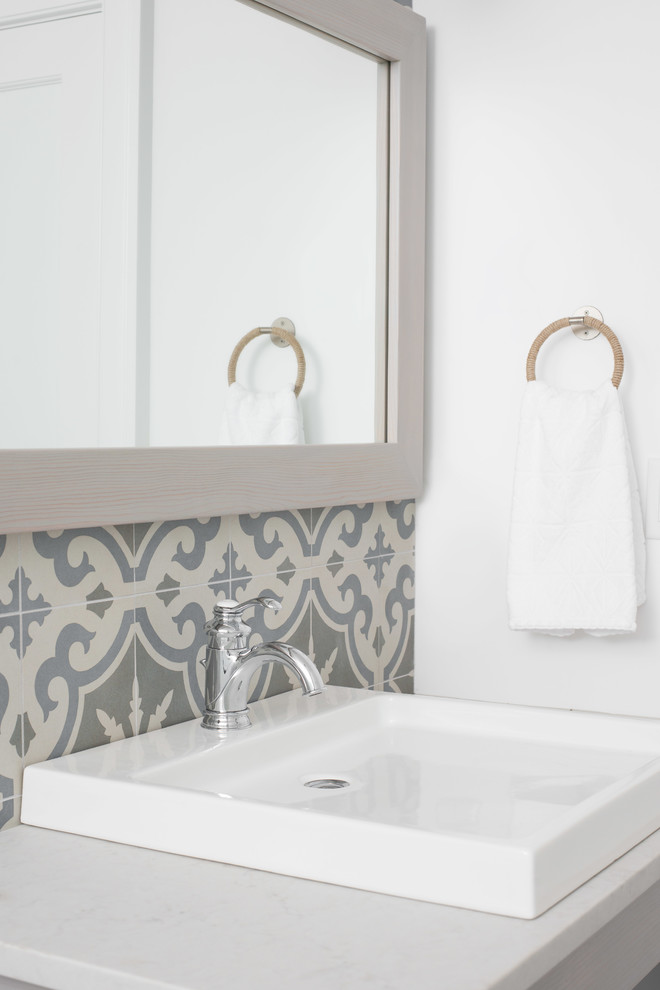 Mid-sized transitional home design photo with an undermount sink and marble countertops