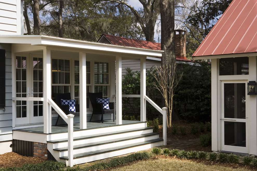 Photo of a mid-sized traditional two-storey blue exterior in Atlanta with wood siding.