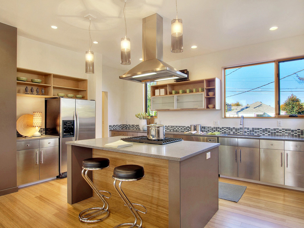 Photo of a modern kitchen in Seattle with stainless steel cabinets.