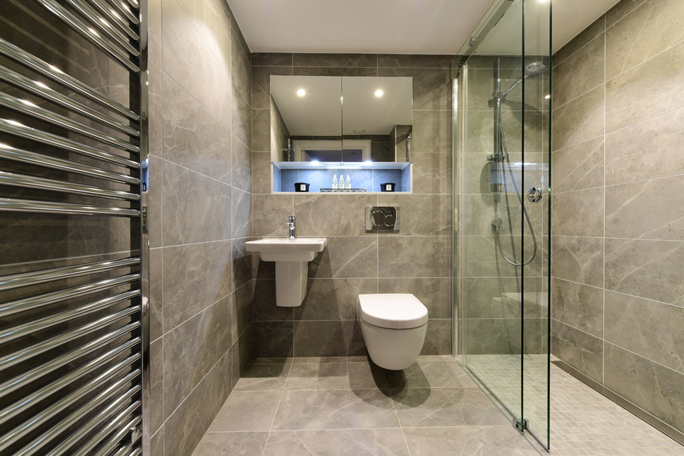Inspiration for a mid-sized contemporary kids bathroom in London with glass-front cabinets, an open shower, a one-piece toilet, gray tile, porcelain tile, grey walls, porcelain floors, grey floor and an open shower.