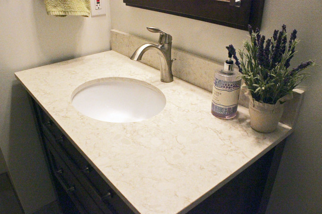 Beige Tiled Shower And Free Standing Vanity With Quartz Countertop