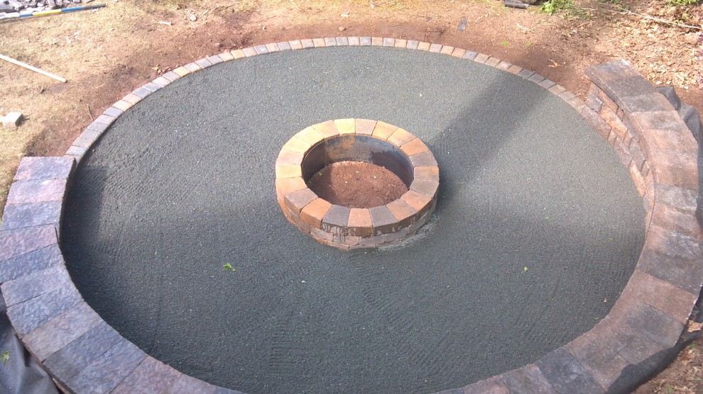 Inspiration for a rustic backyard concrete paver landscaping with a fire pit for summer.