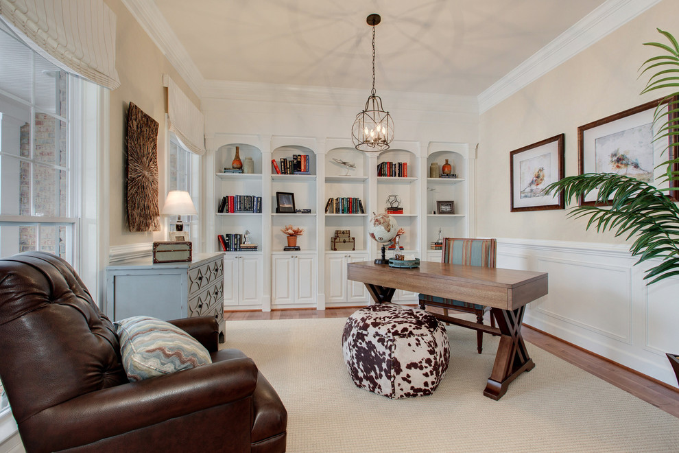 Mid-sized transitional home office in DC Metro with beige walls, vinyl floors, no fireplace and a freestanding desk.