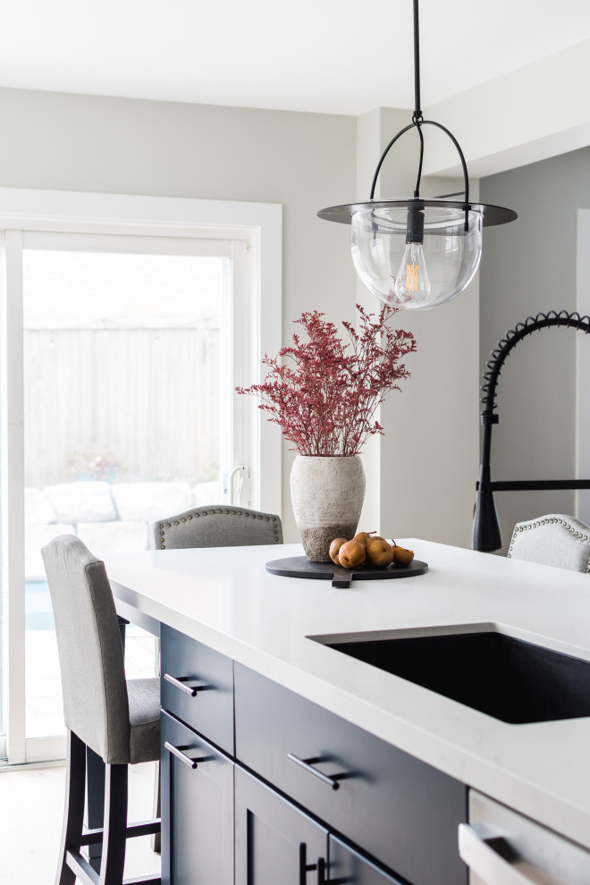 Example of a transitional kitchen design in Toronto