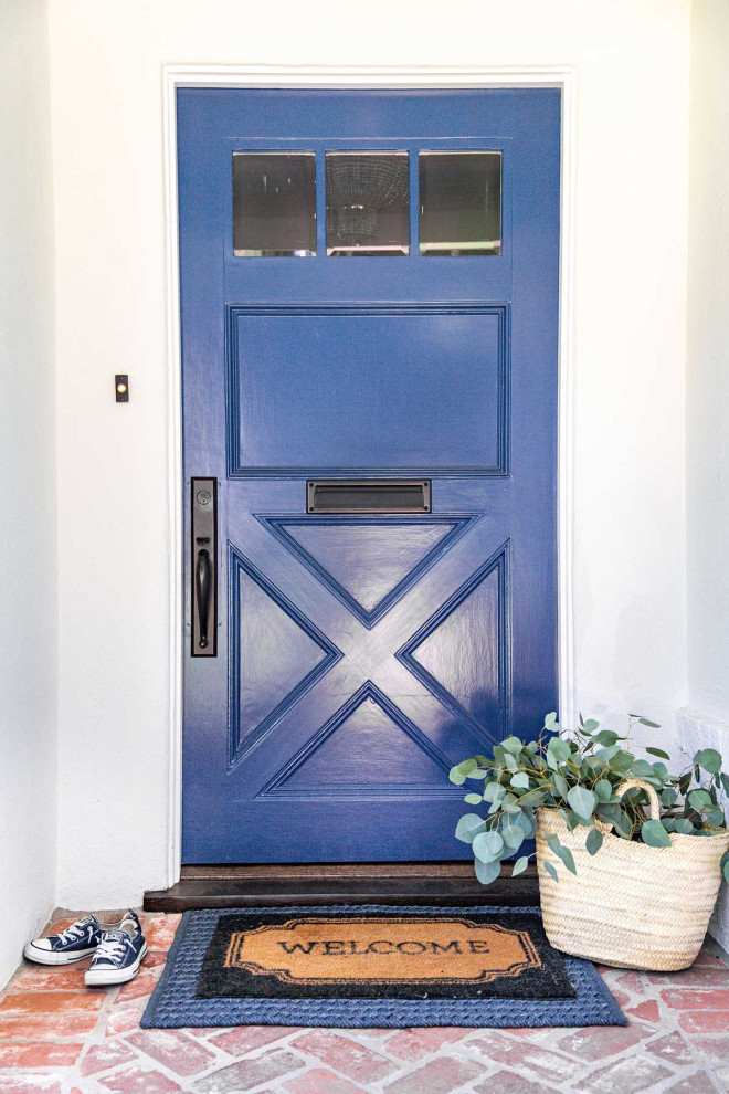 This is an example of a mid-sized traditional front door in Other with a single front door and a white front door.