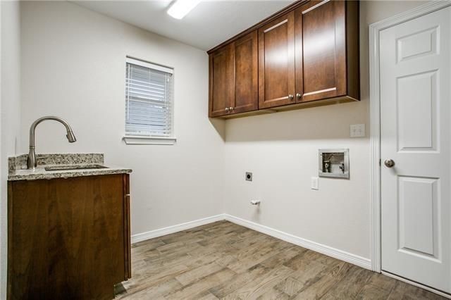 Example of a transitional porcelain tile home design design in Dallas with an undermount sink, shaker cabinets, brown cabinets and granite countertops