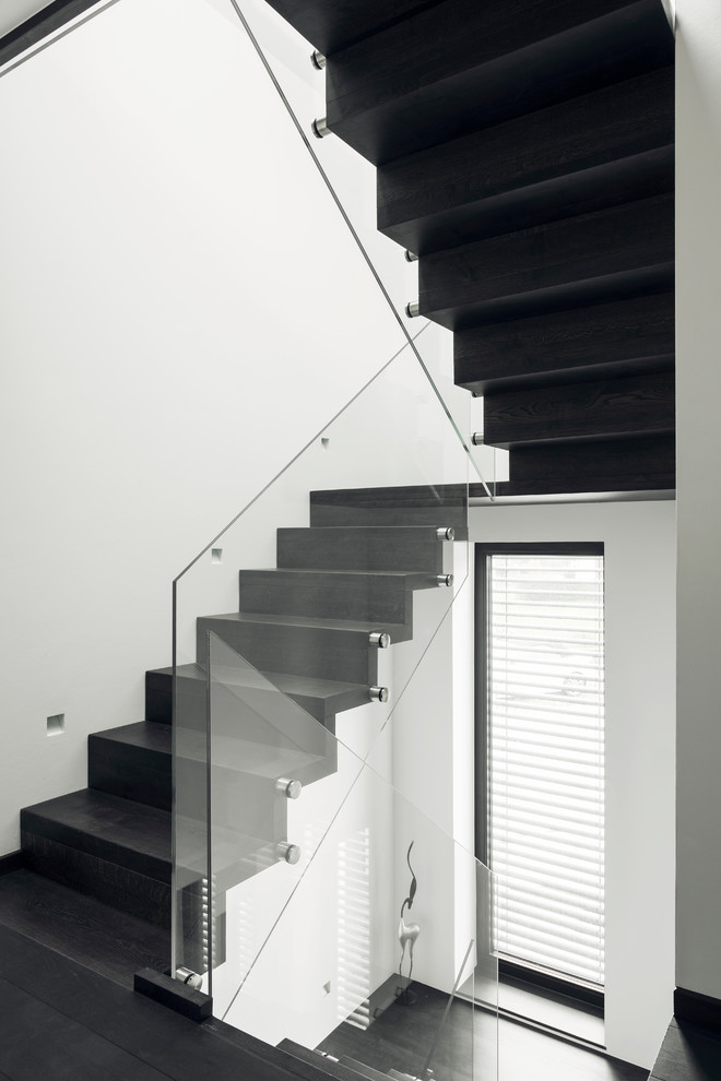 Mittelgroße Moderne Treppe in U-Form mit Holz-Setzstufen