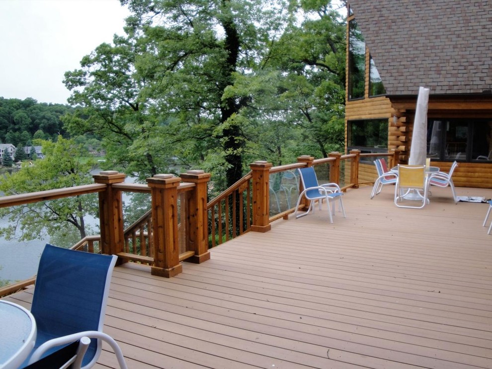 Large mountain style backyard balcony deck photo in Detroit with no cover
