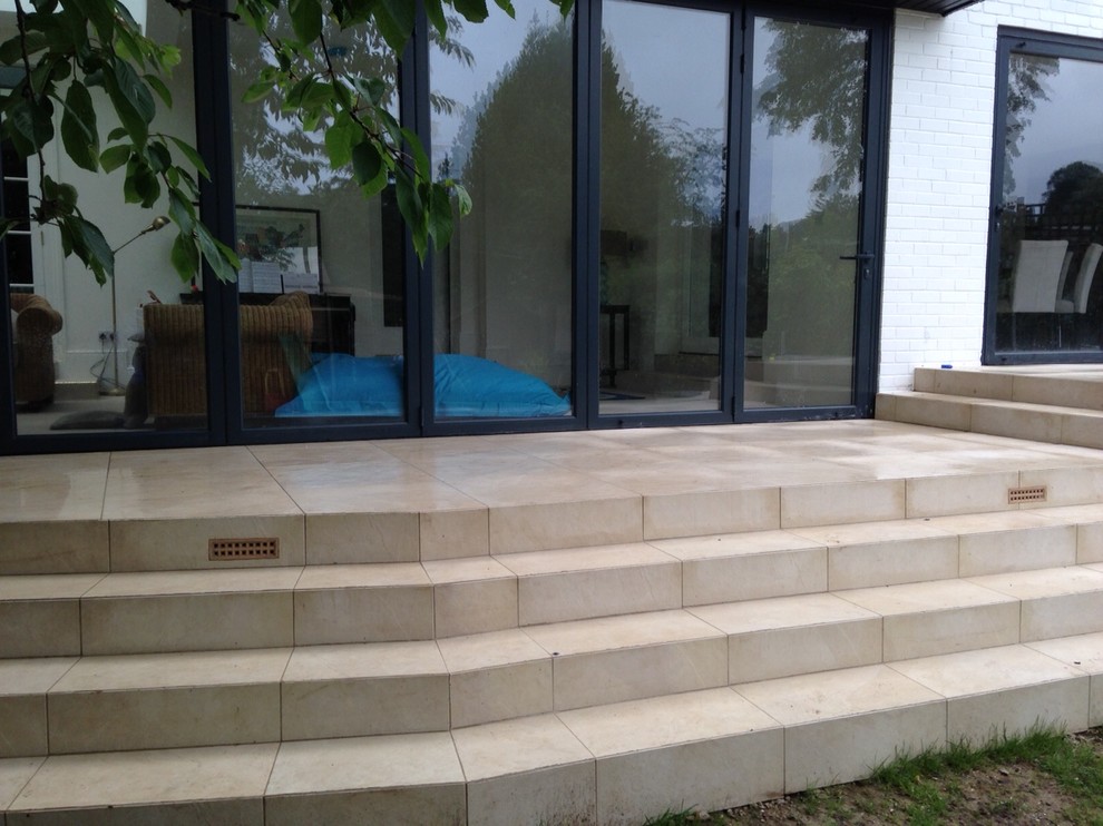 Patio in Hampshire with tile.