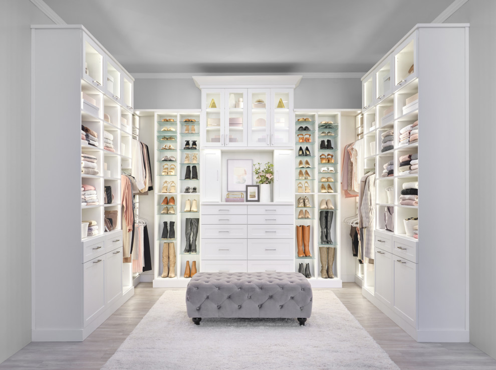 Large contemporary storage and wardrobe in Burlington with white cabinets.