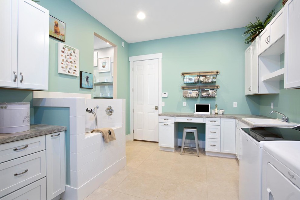 This is an example of a transitional laundry room in Indianapolis.