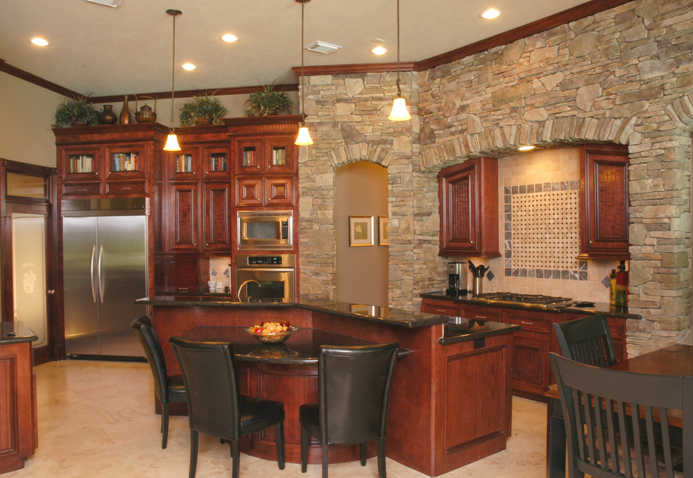 Eat-in kitchen - eat-in kitchen idea in Houston with granite countertops, beige backsplash, custom tile backsplash and stainless steel appliances