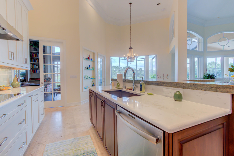 Enclosed kitchen - large transitional single-wall enclosed kitchen idea with an undermount sink, flat-panel cabinets, white cabinets, quartz countertops, blue backsplash, stone tile backsplash, stainless steel appliances and an island