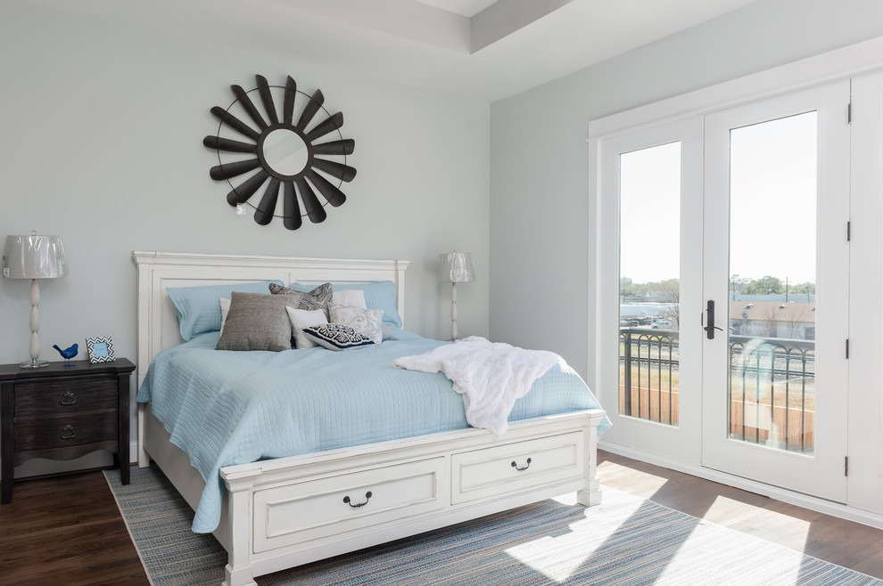 Design ideas for a traditional bedroom in Houston with blue walls and dark hardwood floors.