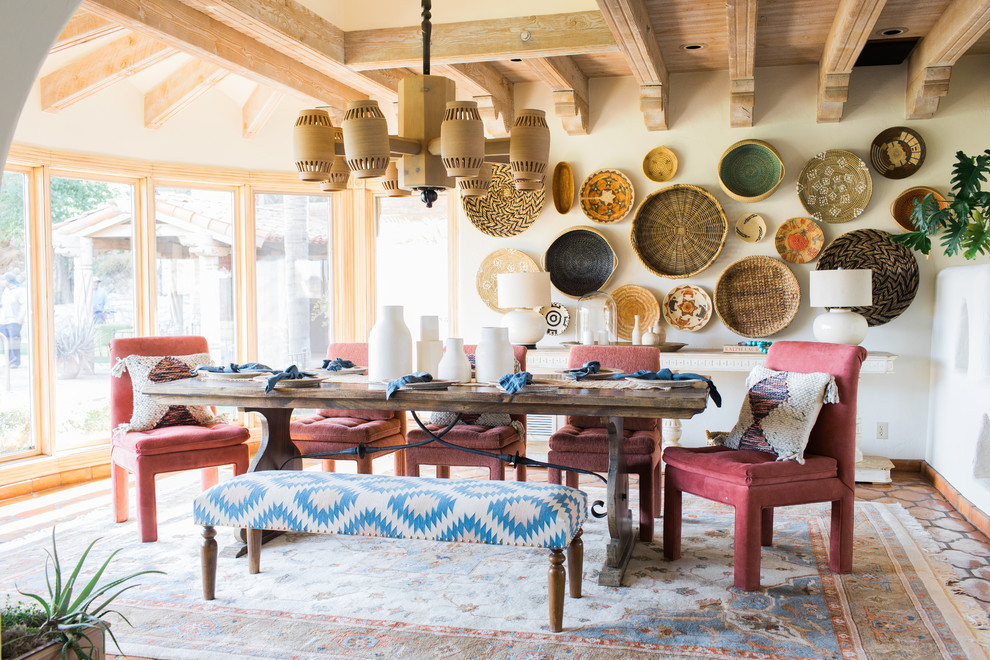 Dining room - southwestern brown floor dining room idea in Phoenix with white walls