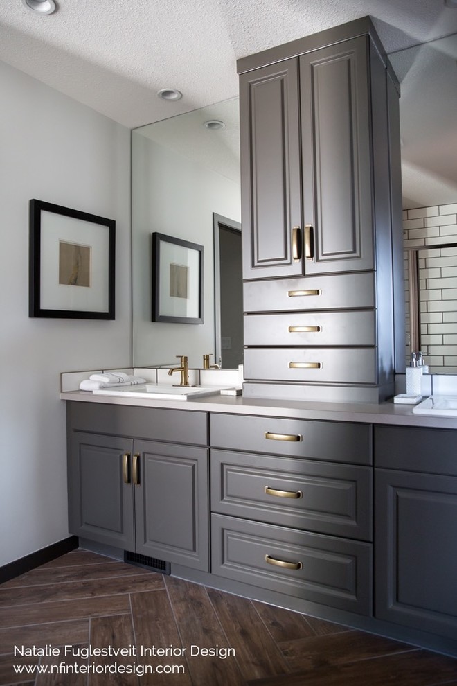 Photo of a small traditional master bathroom in Calgary with raised-panel cabinets, grey cabinets, an alcove shower, a two-piece toilet, white tile, ceramic tile, white walls, porcelain floors, a drop-in sink and laminate benchtops.